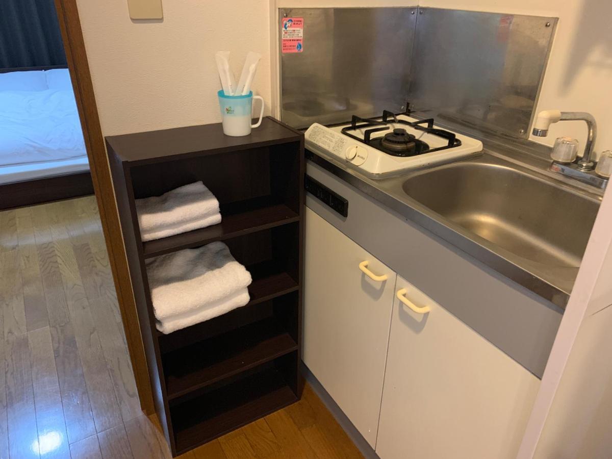 Ao Dazaifu Aparthotel Chikushino Bagian luar foto
