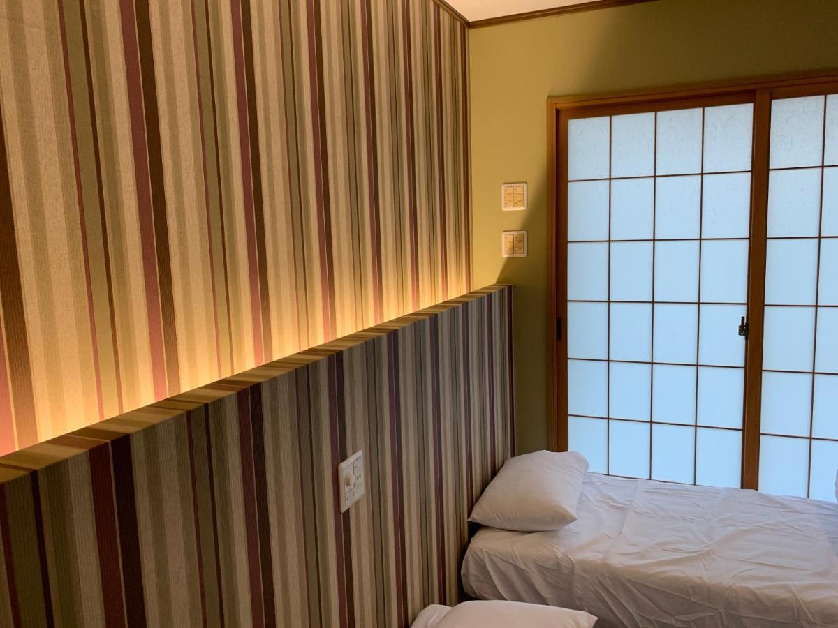 Ao Dazaifu Aparthotel Chikushino Bagian luar foto