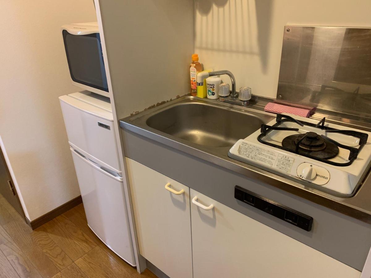 Ao Dazaifu Aparthotel Chikushino Bagian luar foto